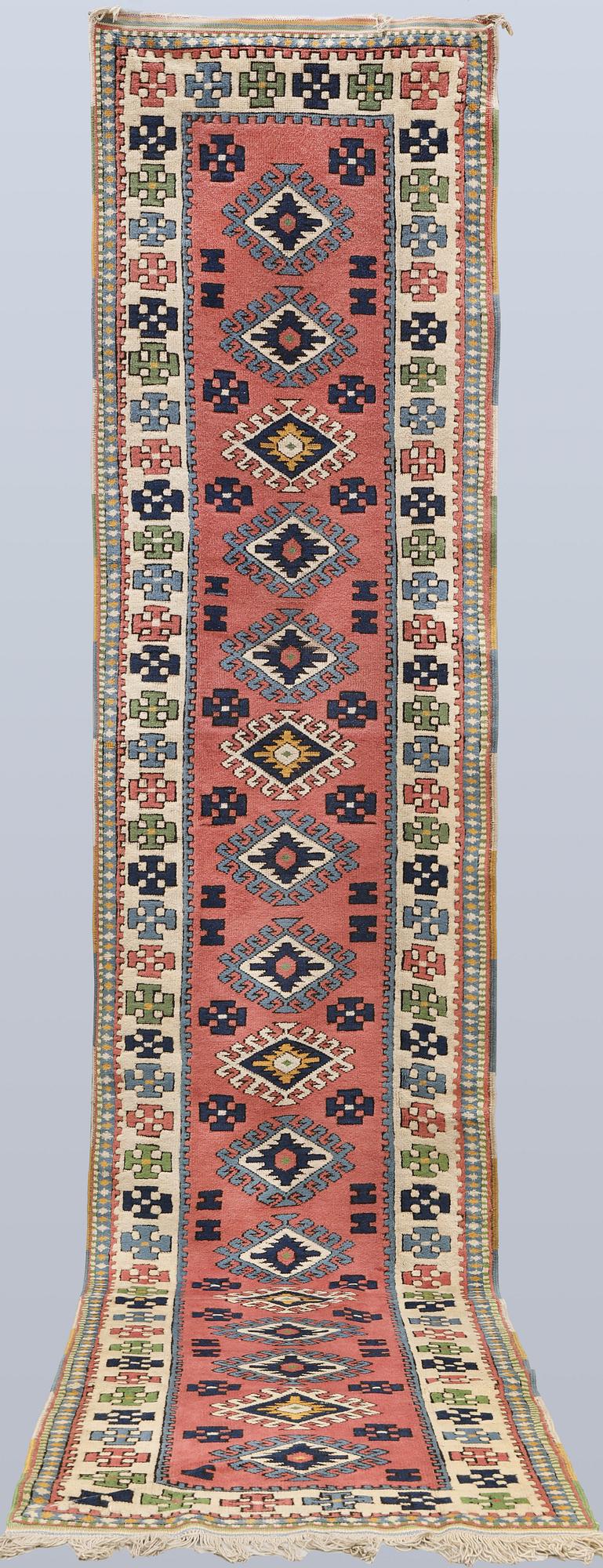 A semi-antique Kars runner, approx. 431 x 95 cm.