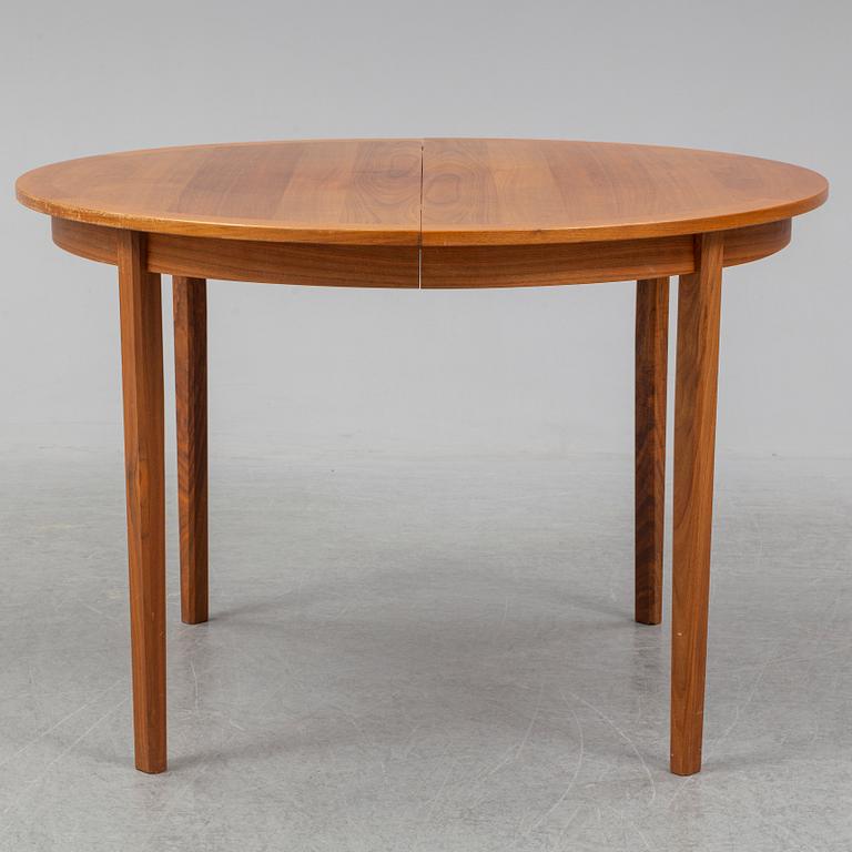 A 1950/60s teak and valnut table and four chairs.
