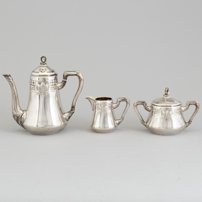 A Swedish Art Nouveau three piece parcel-gilt and silver coffee service, maker's mark CG Hallberg, Stockholm 1911-12.