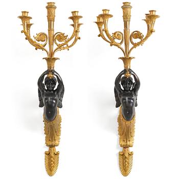 258. A pair of Napoleon III five-branch gilt and patinated bronze appliques.
