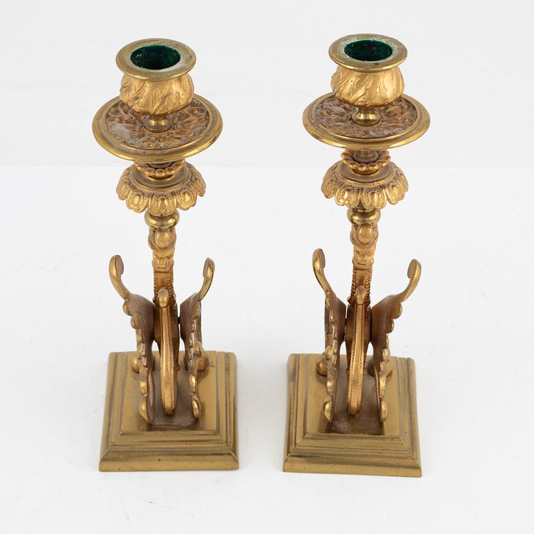 A pair of brass candleholders, 20th century.