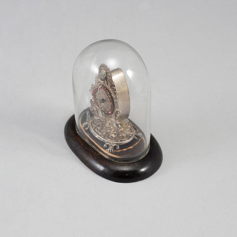 A 19th century miniature silver mantle clock.