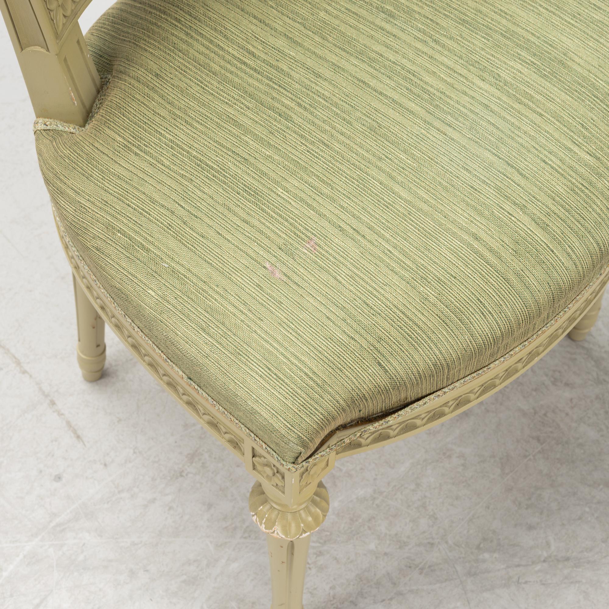 A Gustavian dining table with six chairs. Åmells dated 1974.