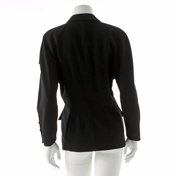 ESCADA, a black wool jacket with decor of gold colored numbers.