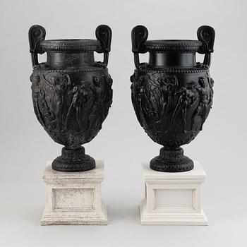 A pair of basalt ware volute vases, 19th century.