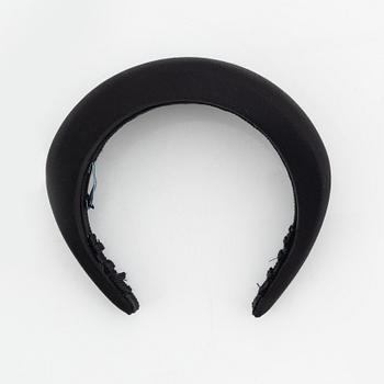 Prada, a black silk hair accessory.