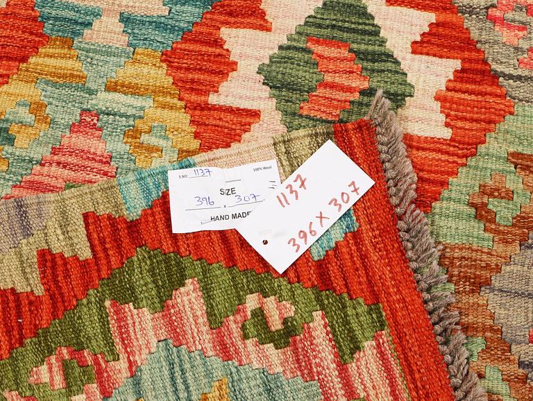 A Kilim carpet, c. 396 x 307 cm.