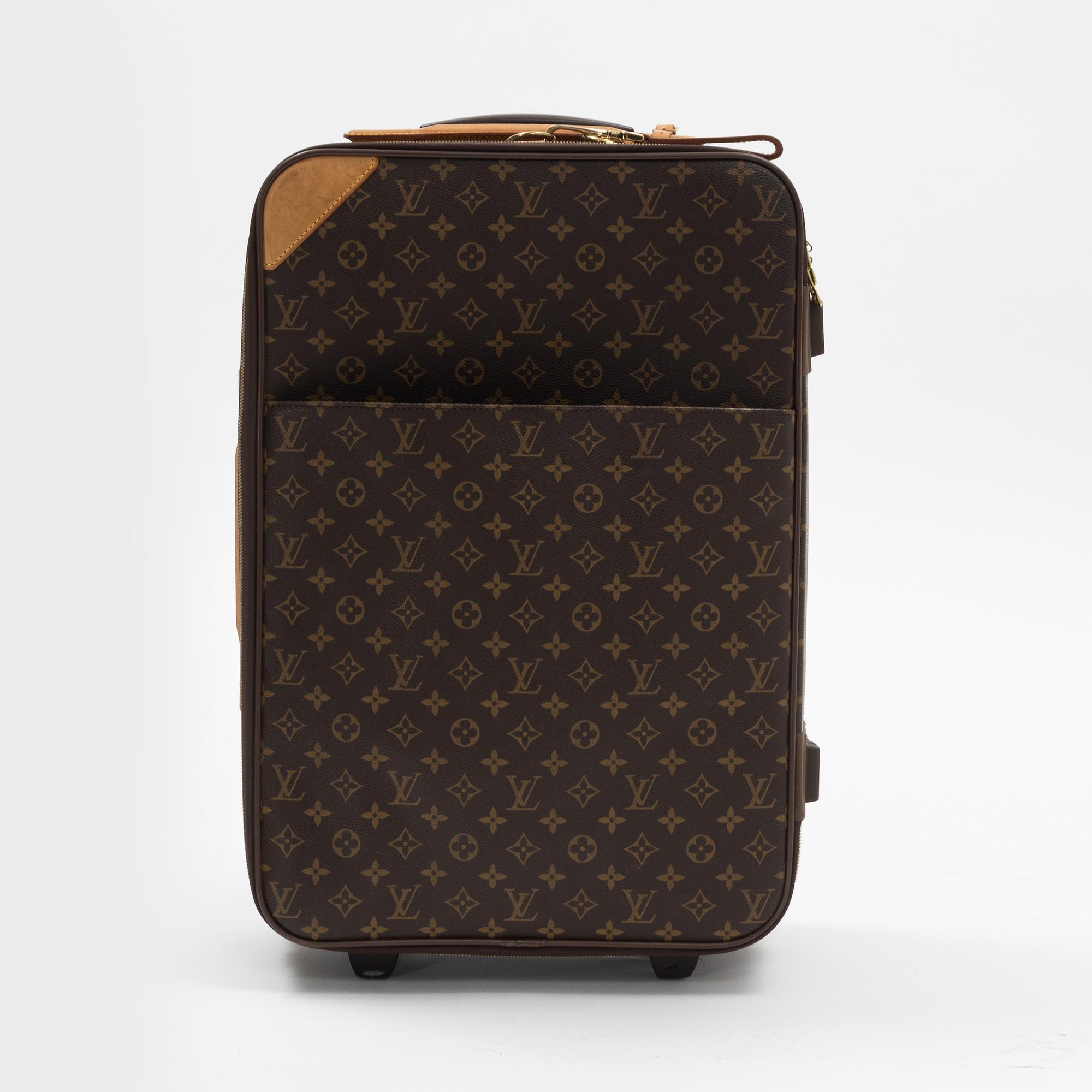 A monogram printed leather "Pegase 45" cabin bag by Louis Vuitton.