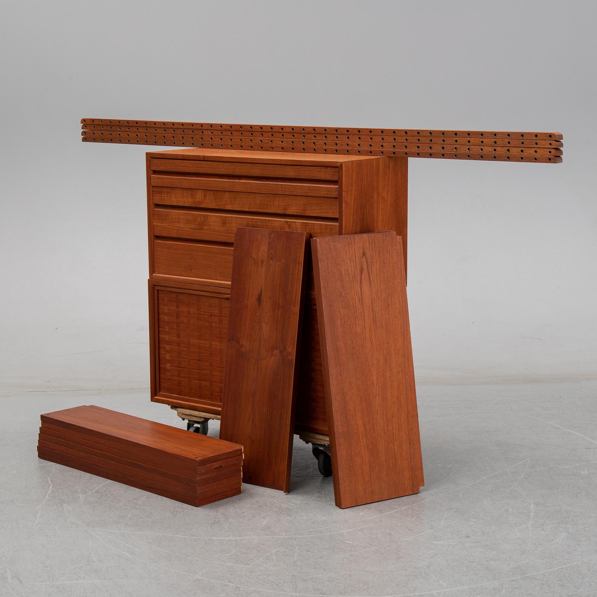 A 1960's teak shelving system by Poul Cadovius.