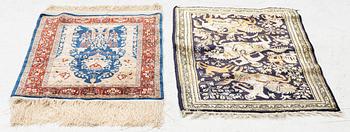 Carpets, two smaller Hereke and Ghom, silk.