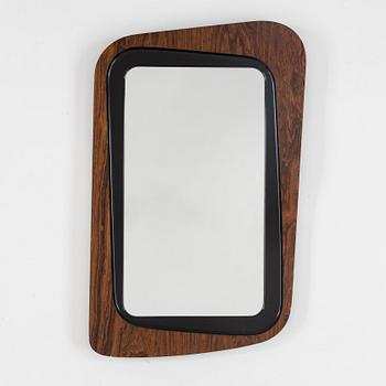 A second half of the 20th century rosewood mirror with table.