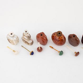 Nine snuff bottles, Peking glass, lacquer, stone and mother of pearl, China, 20th century.