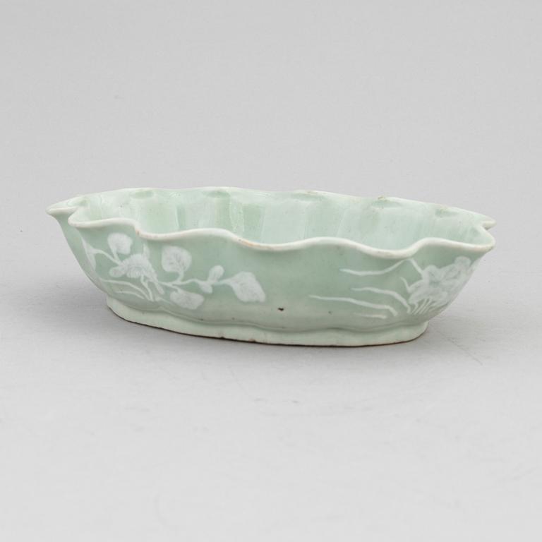 A Chinese celadon glazed lotus leaf shaped bowl, late Qing dynasty, and a ge-glazed brush washer, possibly 20 century.