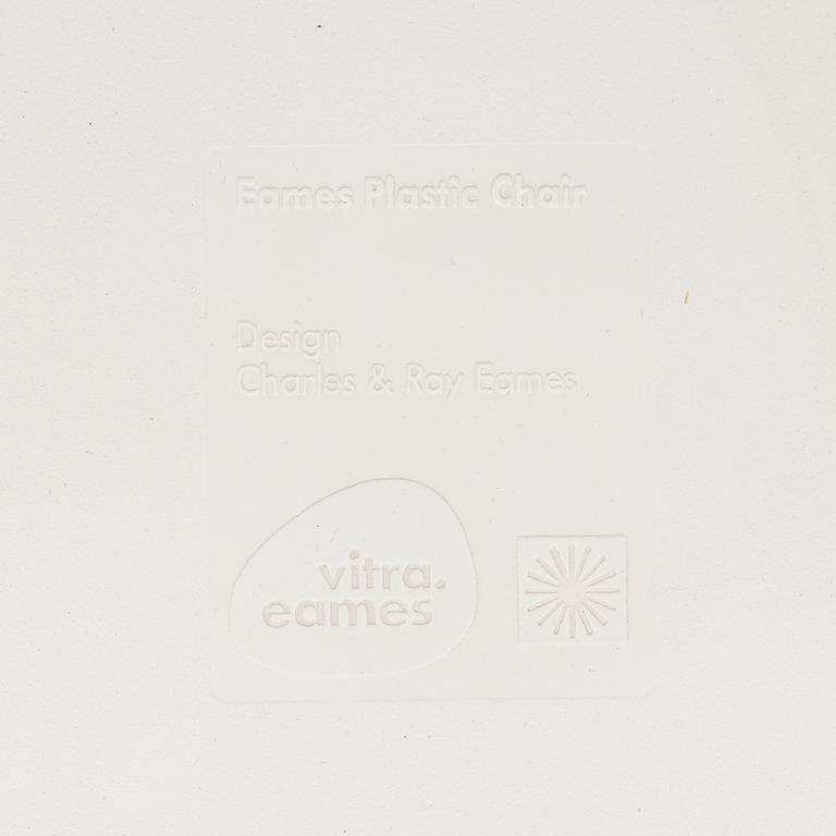 A 'Plastic chair DSW' by Charles and Ray Eames for Vitra.