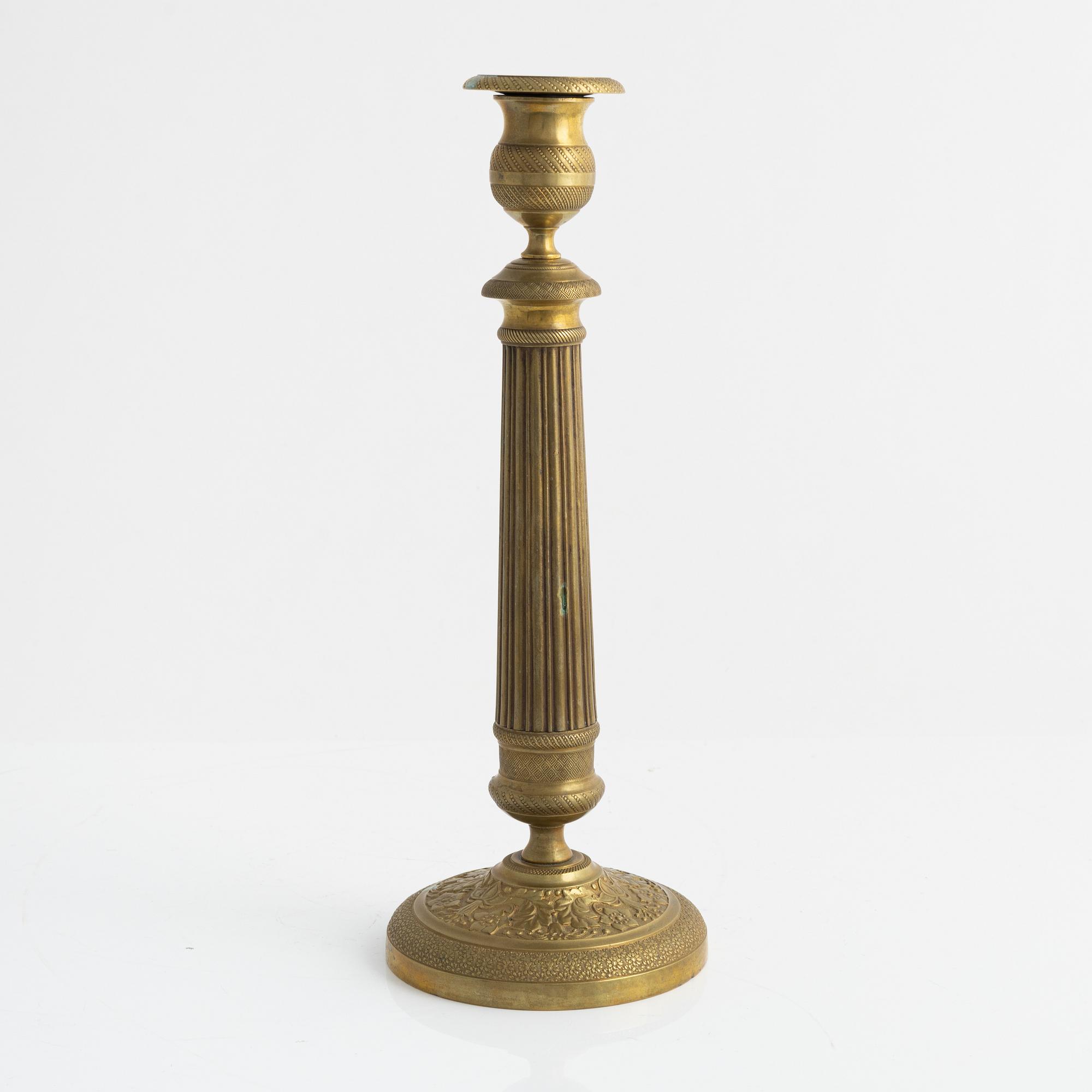 A brass Empire candlestick, first half of the 19th century,