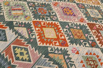 A Kelim carpet, 306 x 257 cm.