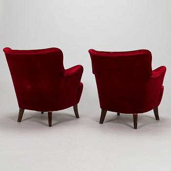 A pair of mid-20th-century armchairs.