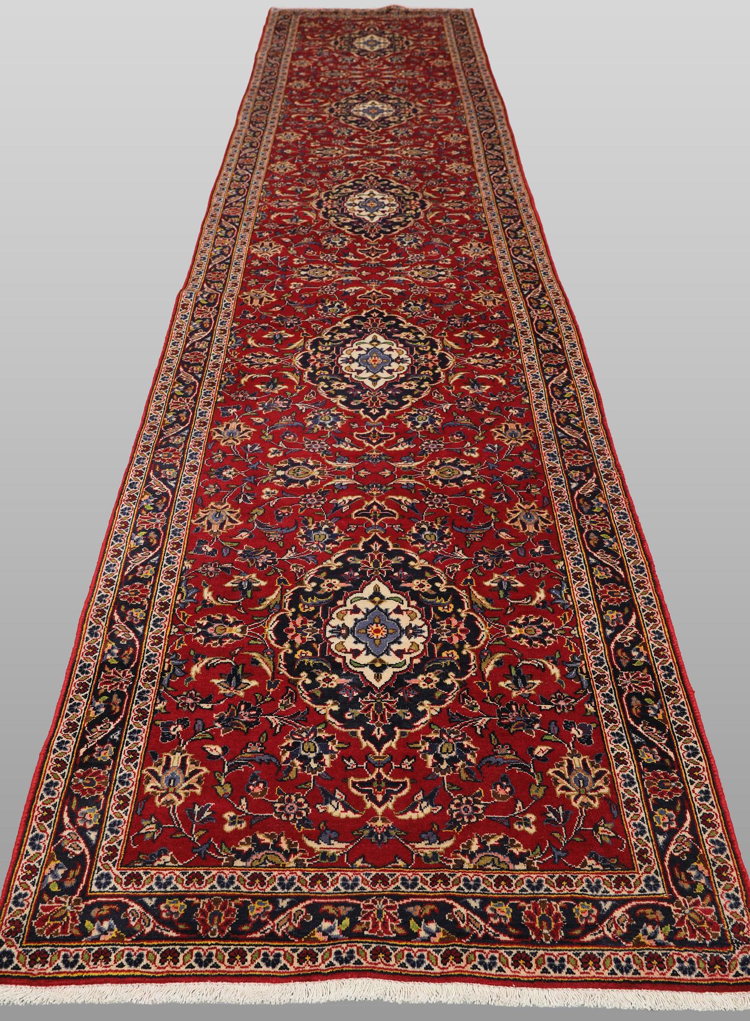 A Keshan runner carpet, 587 x 95 cm.