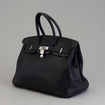 A dark blue togo "Birkin 35" bag by HermÈs from 2009.