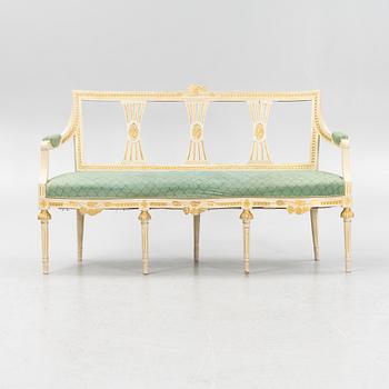A painted and carved Gustavian style sofa, 1920's.