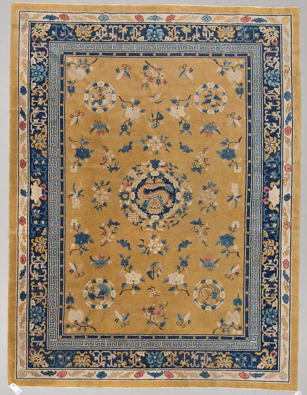 A semi-antique chinese carpet, around  320 x 245 cm.