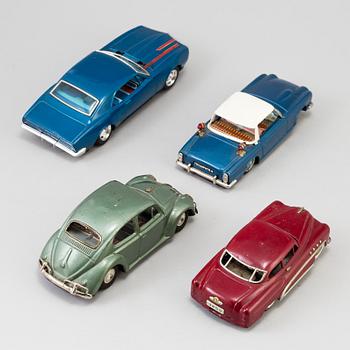 A lot of four tinplate toy cars by Bandai and Marusan, Japan, 1950/60s.