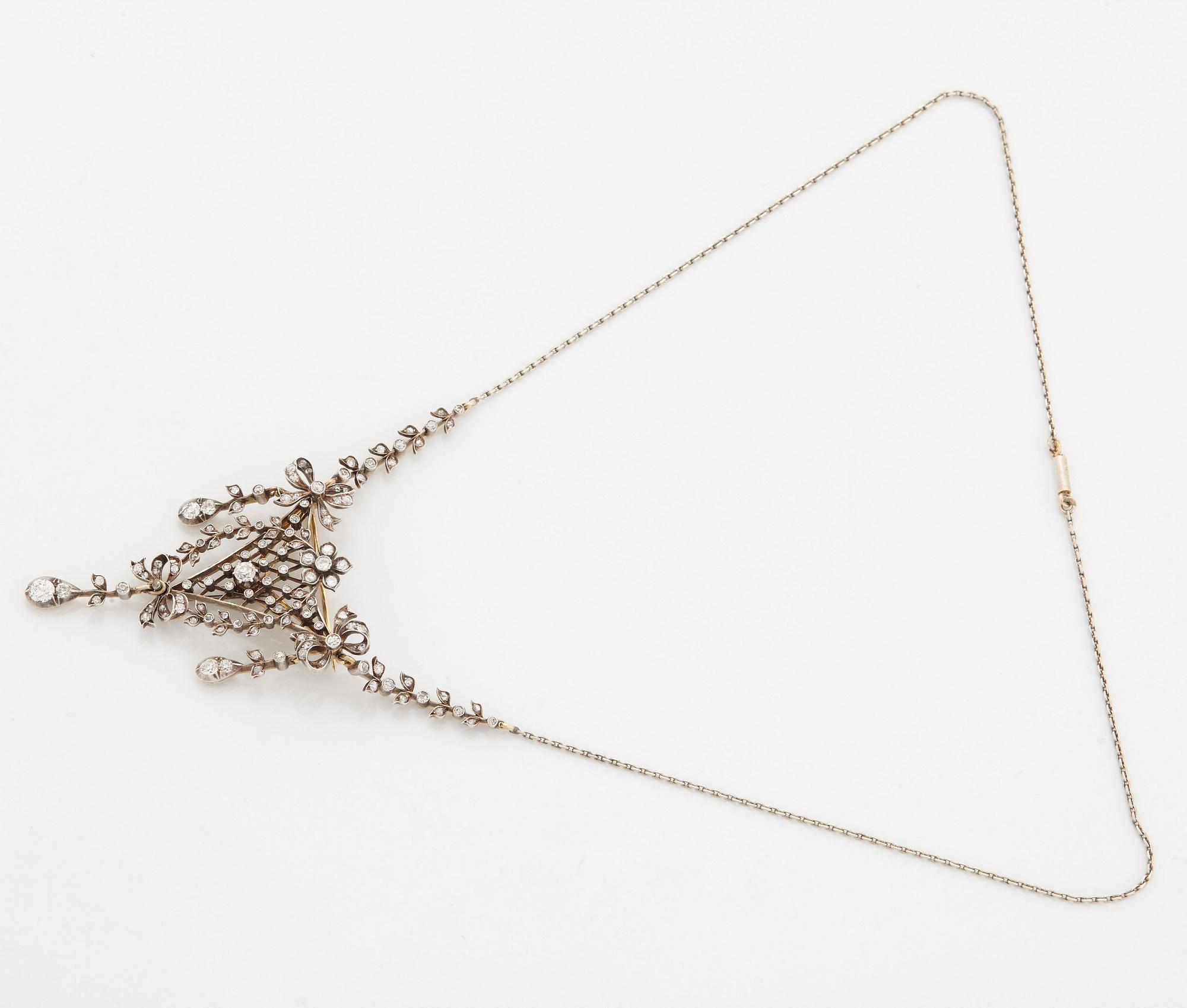 Brosch/hänge 14K guld och silver med gammal- och rosenslipade diamanter.