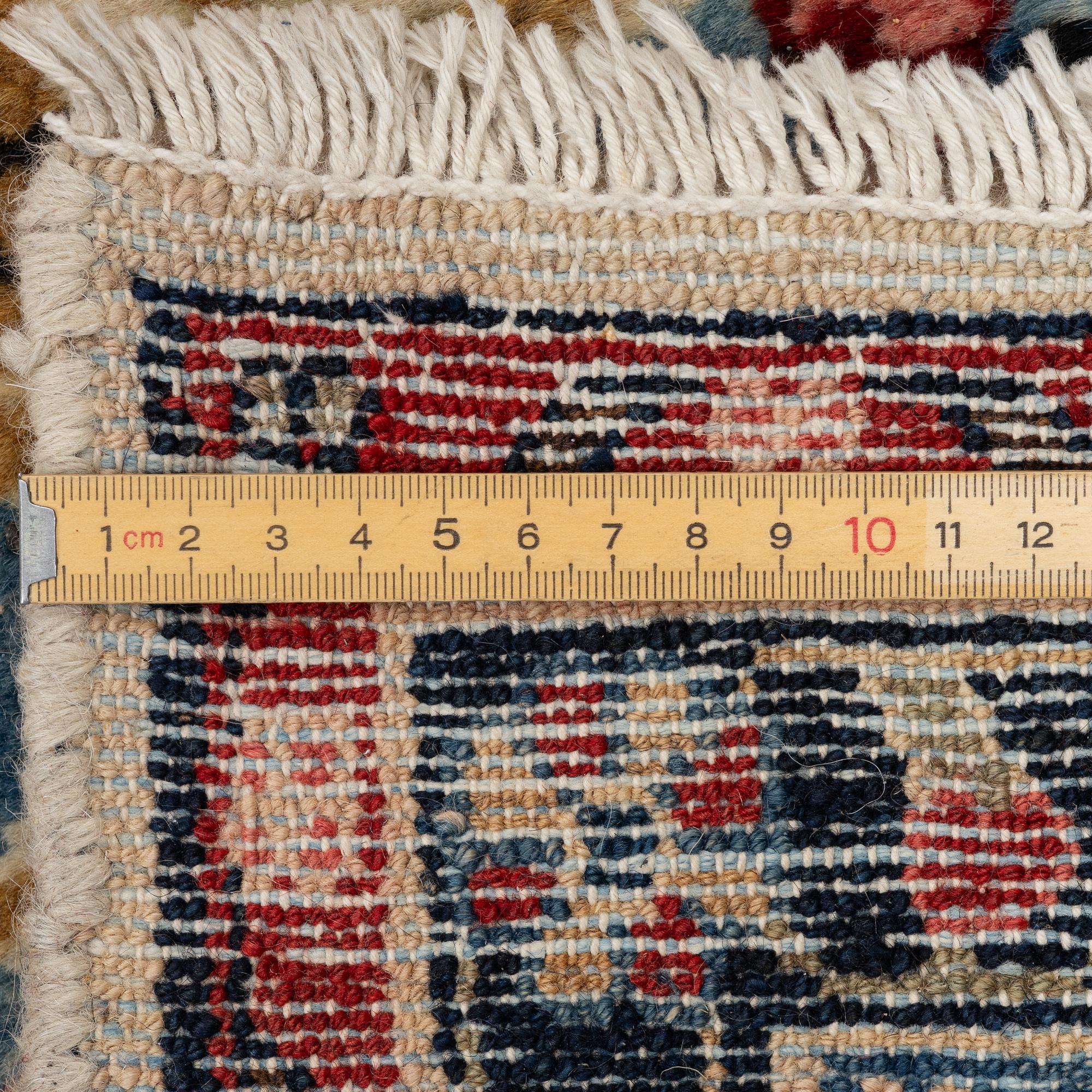 An oriental carpet, c. 370x260 cm.