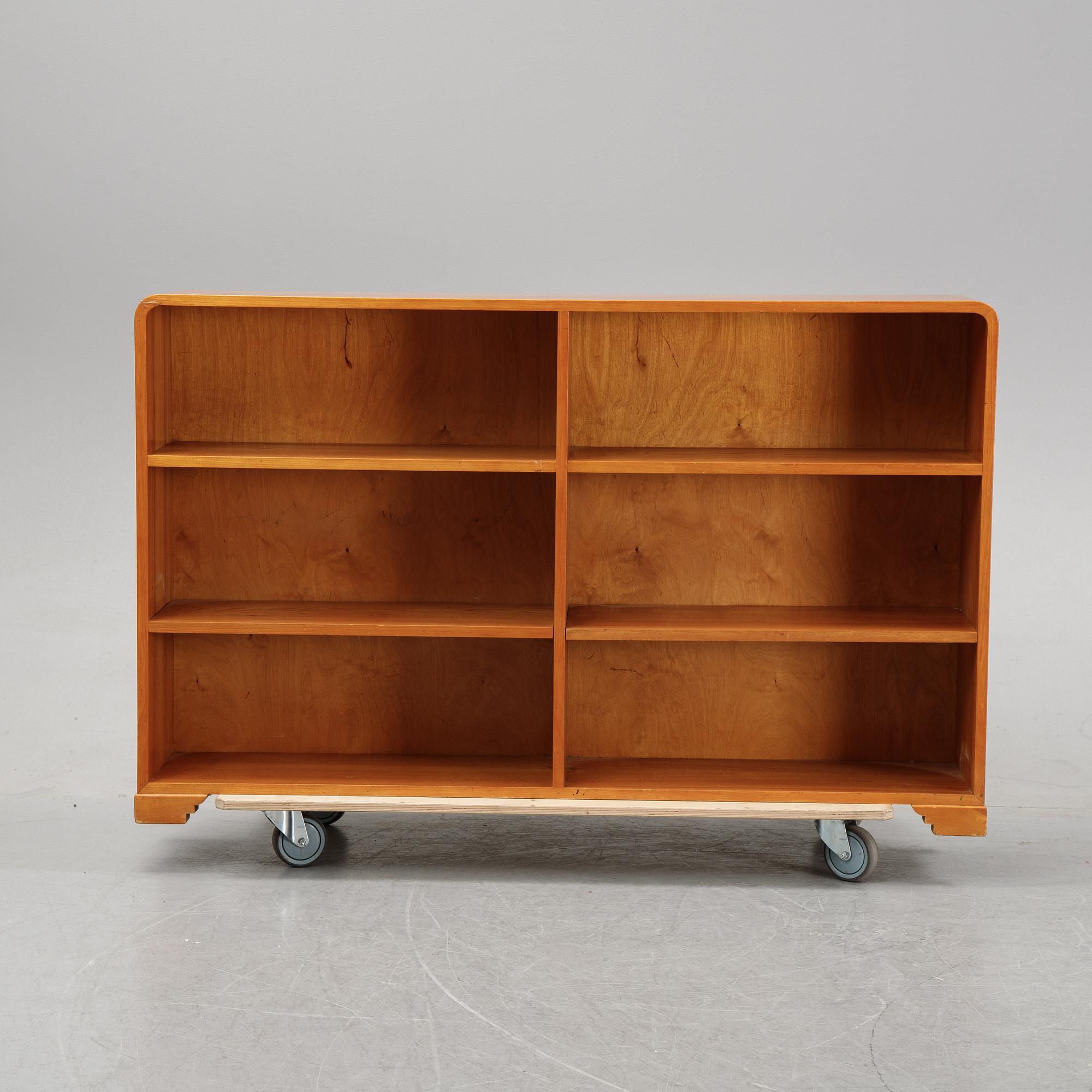 A mid 20th Century elm wood book case.