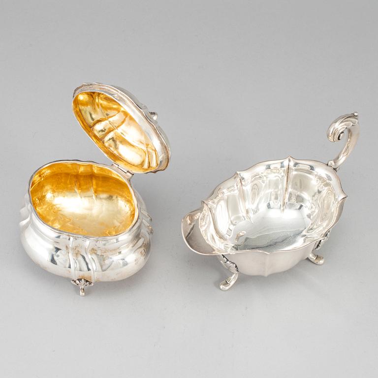 A rococo-style 20th century silver cream-jug and sugar-box, Swedish import marks.