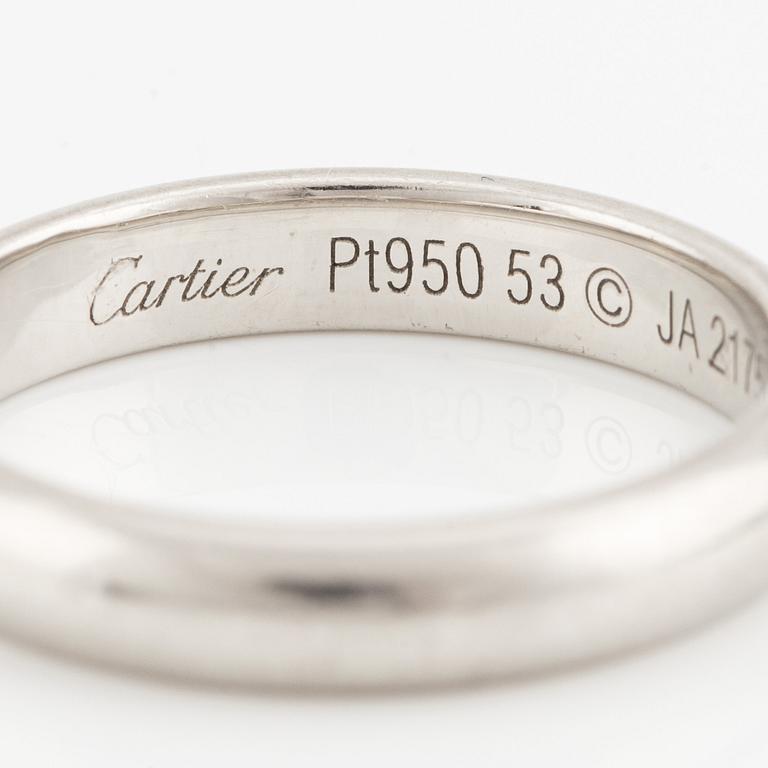 A Cartier platinum ring.