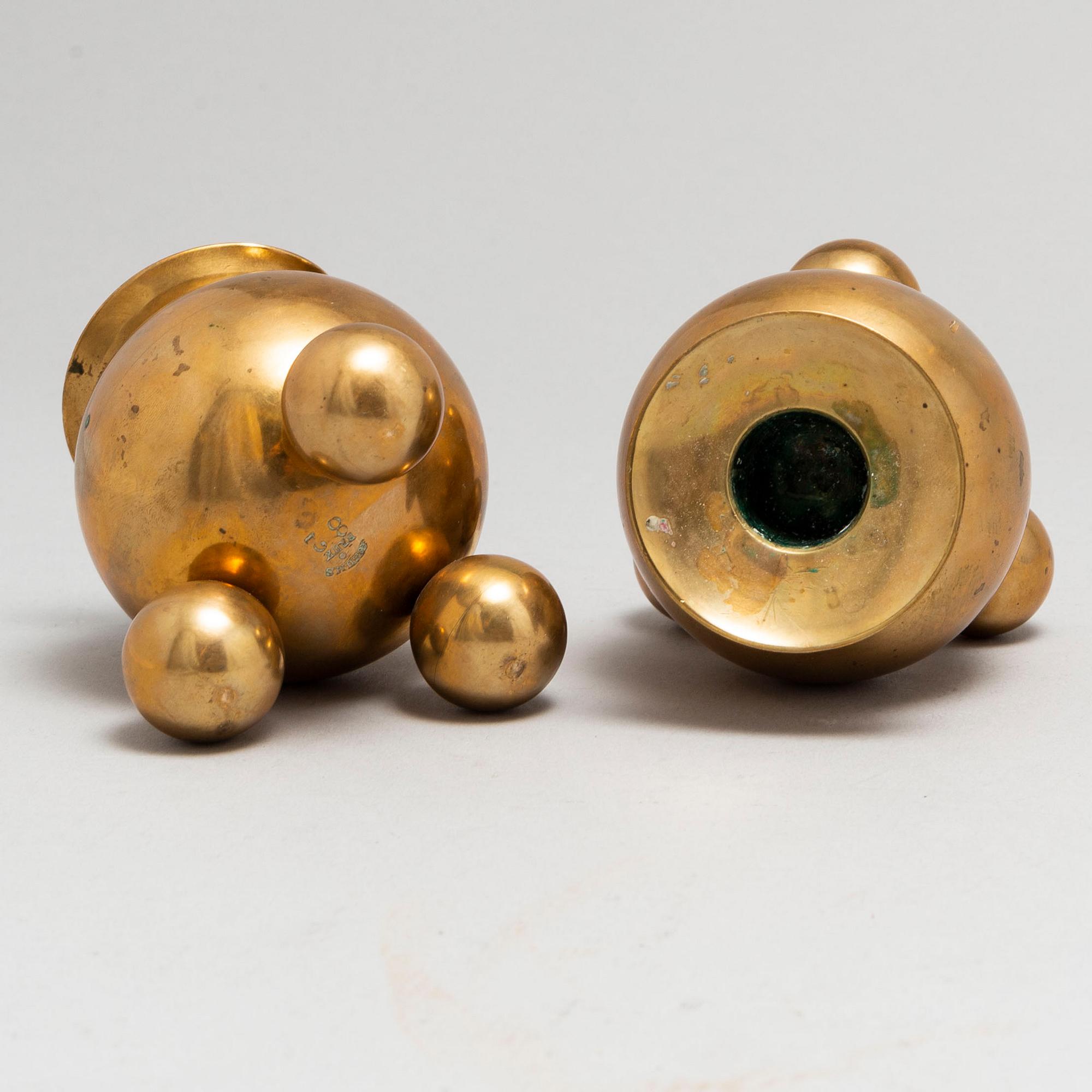 A pair of brass candlesticks from Gusum, circa 1900.