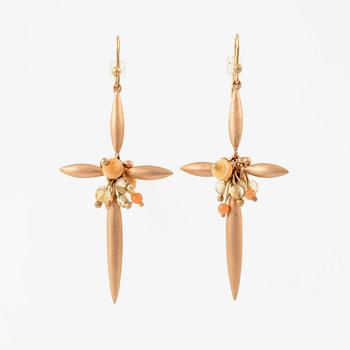A pair of earrings in 14K gold with coral and quartz, by Ted Muehling purchased at Svenskt Tenn.