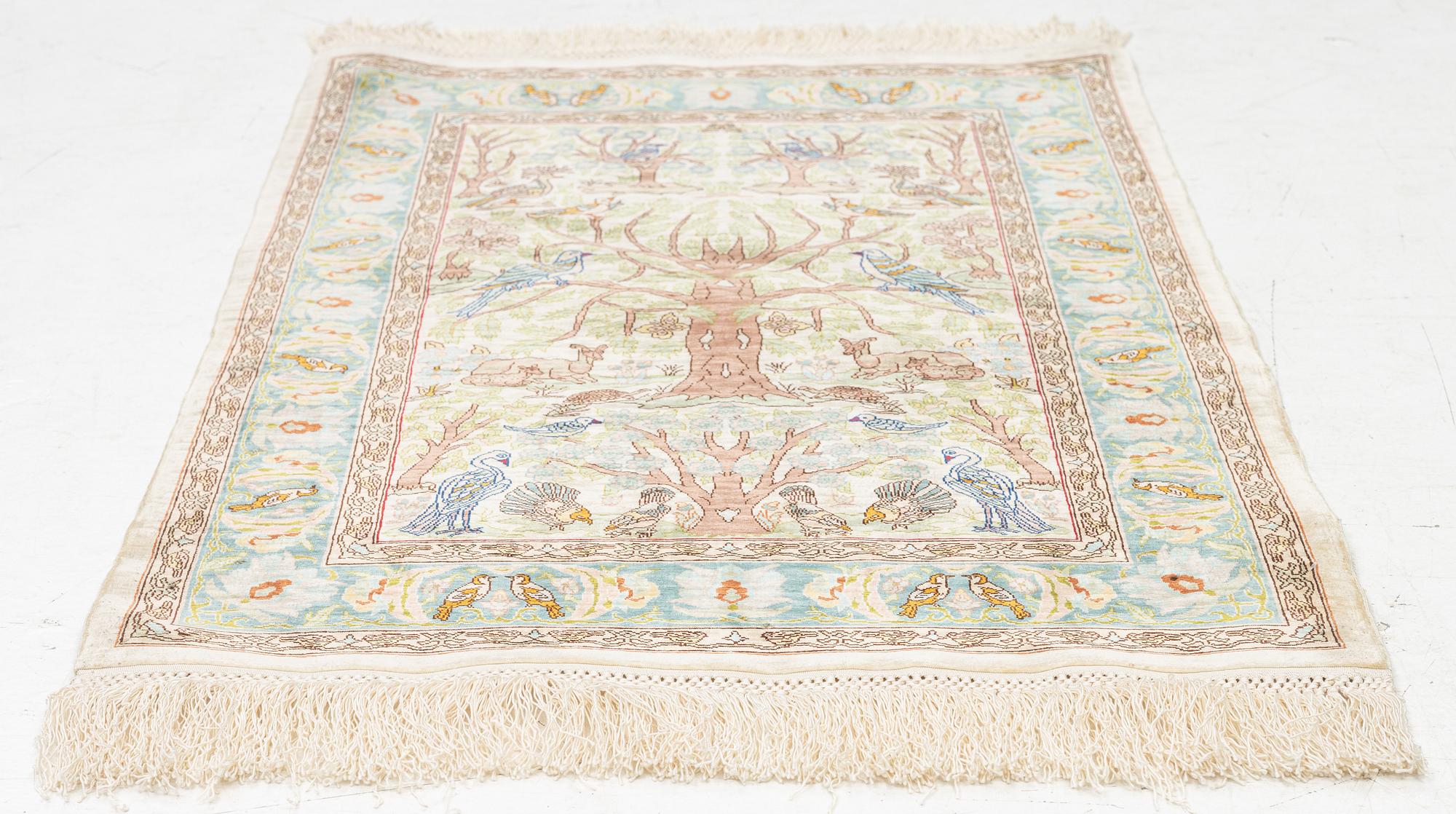 A figural silk Hereke rug, c 65 x 47 cm.