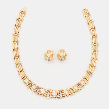 411. A Bulgari demi parure comprising a necklace and a pair of earrings.