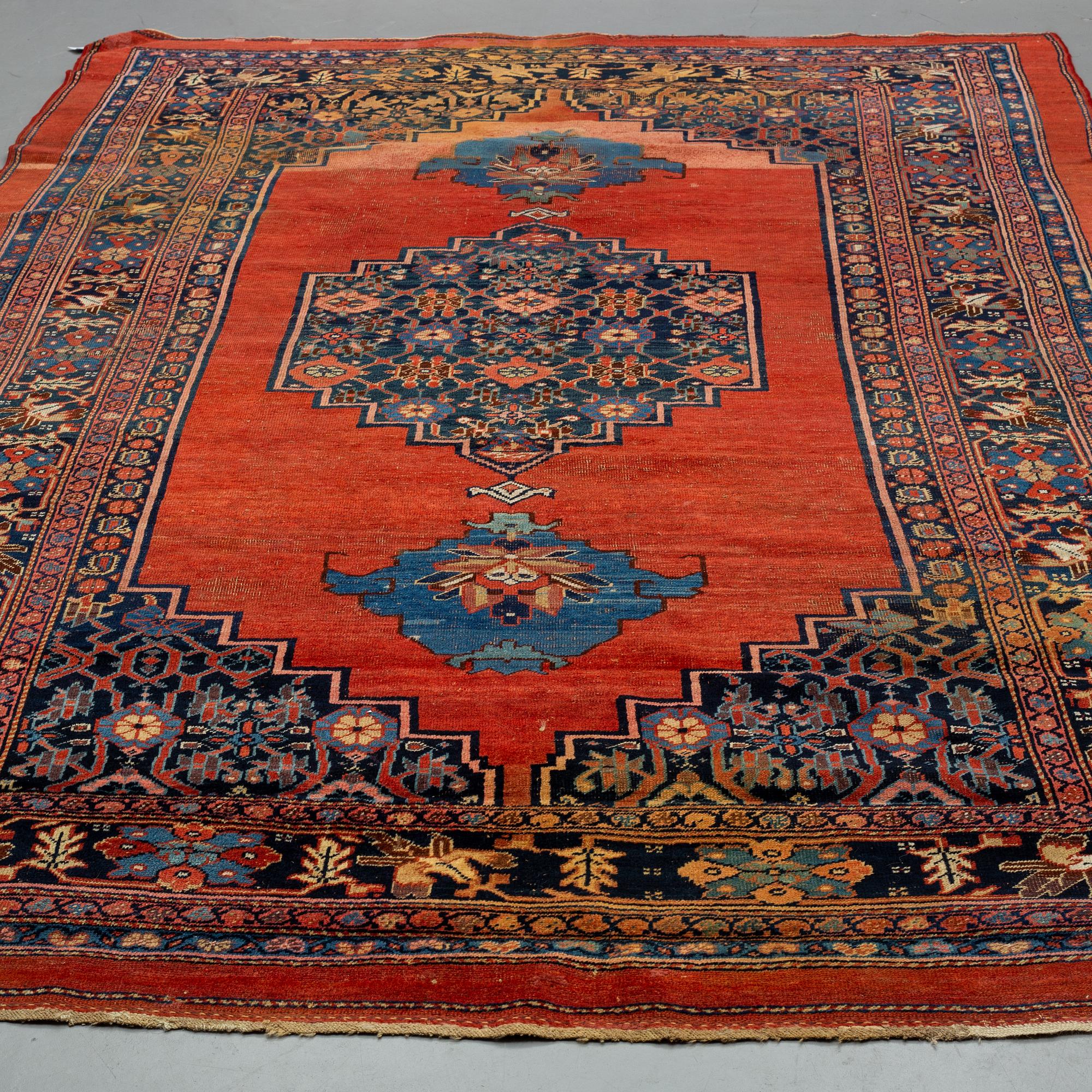 AN ANTIQUE BIDJAR CARPET, CA 374 X 224 CM.