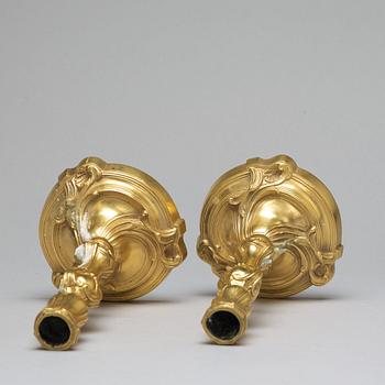 A pair of Louis XV-style candlesticks, circa 1900.