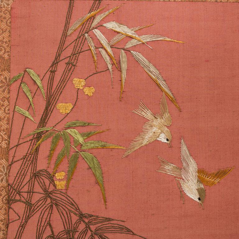 A Japanese embroidered four fold screen, 20th Century.