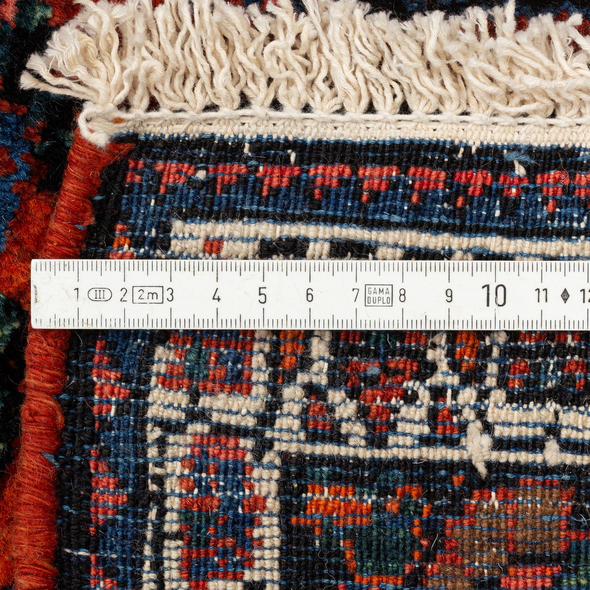 A semi-antique Abadeh carpet, approximately 296 x 191-196 cm.