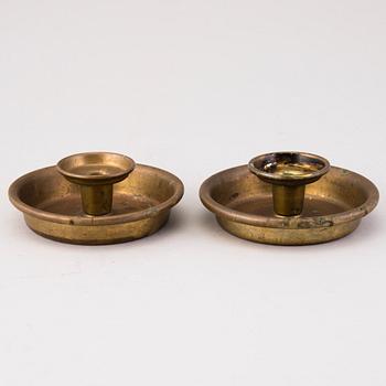 BERTEL GARDBERG, A pair of candleholders in brass, marked Gardberg.
