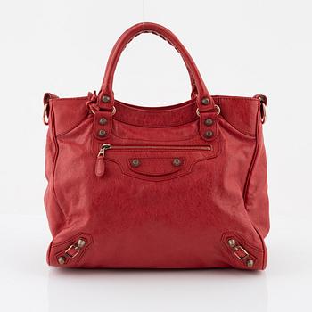 Balenciaga, a red leather 'City' bag.