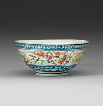 395. A famille rose and underglaze blue dragon bowl, late Qing dynasty, with Guangxus six character mark and of period.