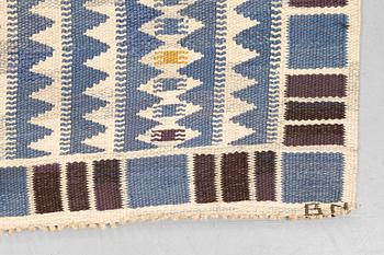 Barbro Nilsson, a carpet, "Salerno blå", flat weave, ca 245 x 177 cm, signed AB MMF BN.