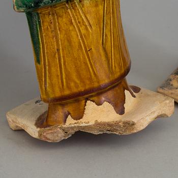 A group of eight chinese figures with three objects, earthenware, Ming dynasty.