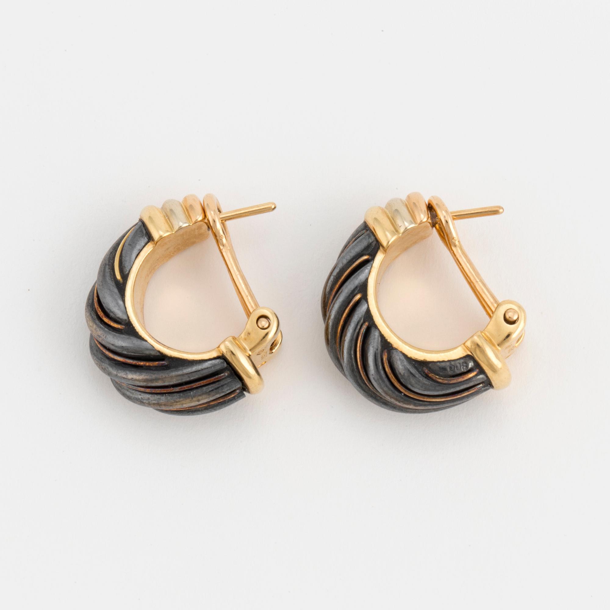 A pair of Cartier hoop earrings.