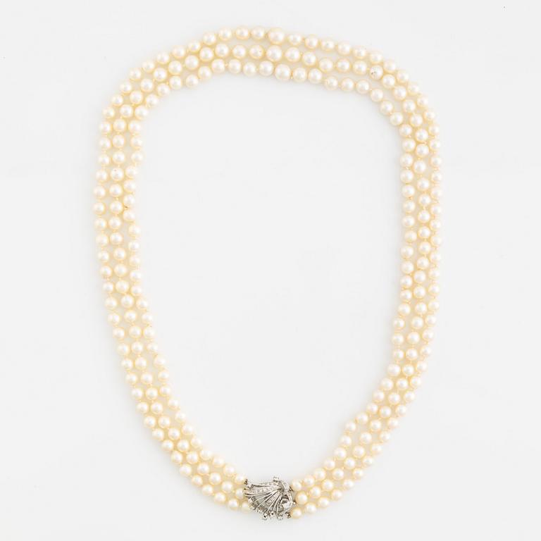Cultured pearl necklace, three strand, calibrated, clasp with diamonds.