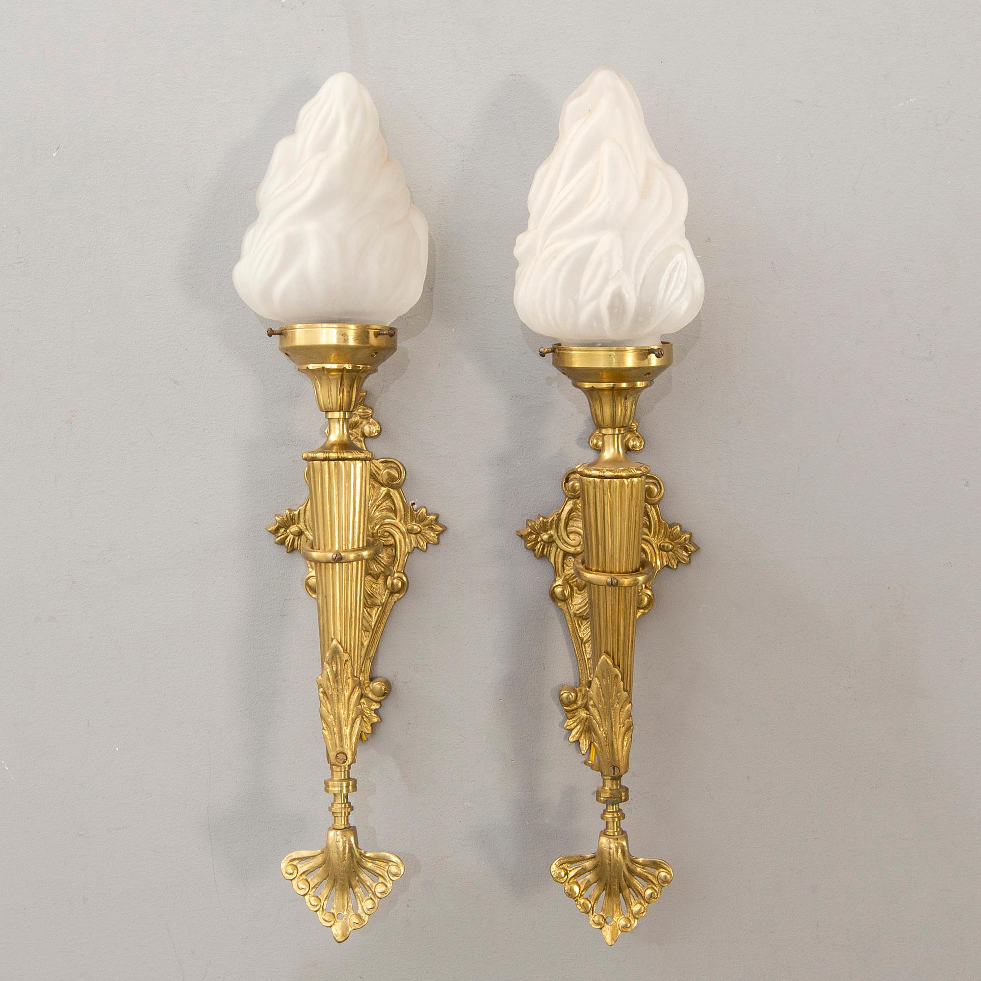 A pair of wall lamps later part of the 20th century.