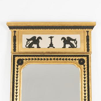 A Swedish Empire giltwood and bronzed mirror attributed to Jonas Frisk (master in Stockholm 1805-24).
