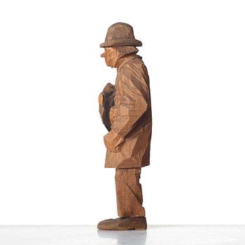 Axel Petersson Döderhultarn, Man holding boots.