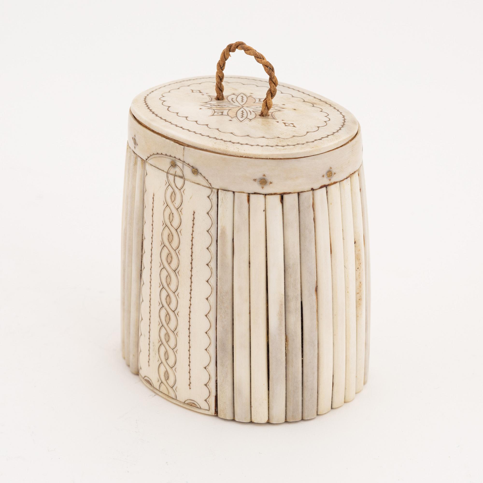 A birch box covered with engraved reindeer horn.